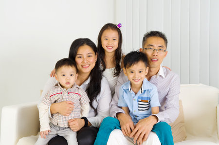 Indoor portrait of asian familyの写真素材