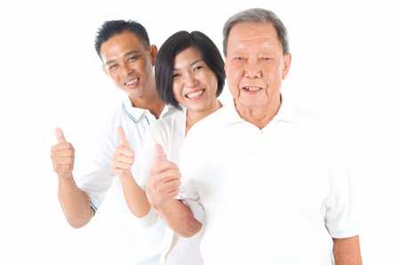 Senior man with his son and daughter. Happy Asian family senior father and adults offspring with...