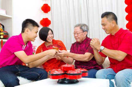 Asian three generations family celebrate chinese new yearの写真素材