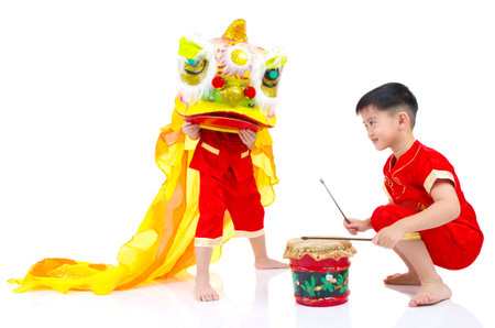 Asian Chinese kids in traditional Chinese cheongsam celebrating chinese new year , isolated on white background.の写真素材