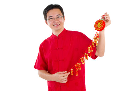 Asian man celebrating chinese new yearの写真素材
