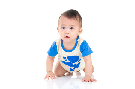 crawling beautiful baby boyの写真素材