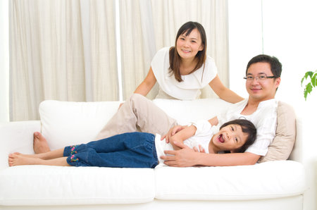 Indoor portrait of asian familyの写真素材