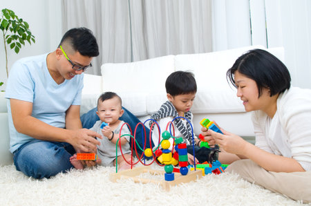 Asian family playing toysの写真素材