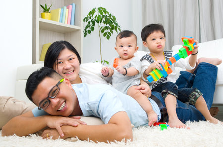 Asian family playing toysの写真素材