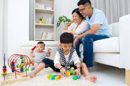 Asian family playing toysの写真素材