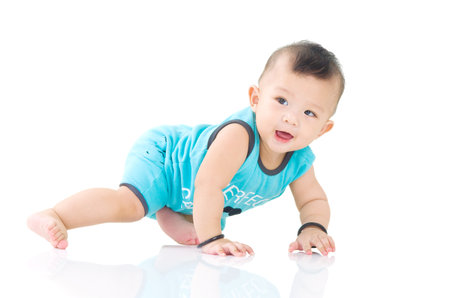 crawling beautiful baby boyの写真素材