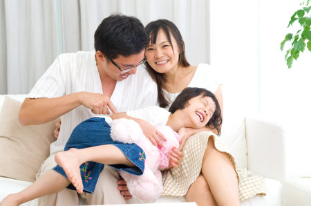 Indoor portrait of asian familyの写真素材