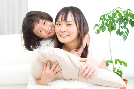 Indoor portrait of asian familyの写真素材