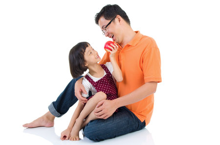 Asian family having fun at homeの写真素材
