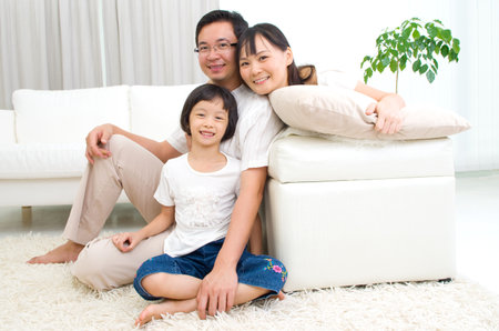 Indoor portrait of asian familyの写真素材