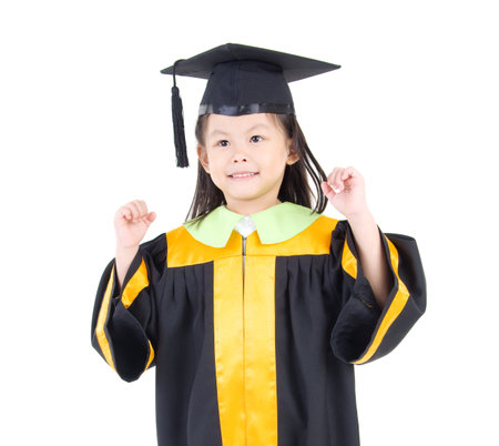 Asian kid in graduation gownの写真素材