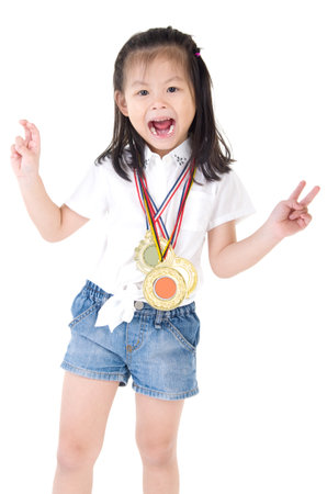 Portrait of asian girl with medals around neckの写真素材