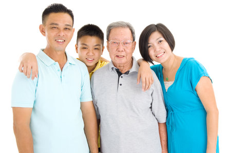 Indoor portrait of beautiful asian 3 generations family over white backgroundの写真素材