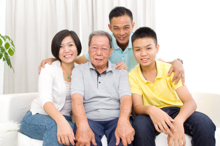 Indoor portrait of beautiful asian 3 generations family