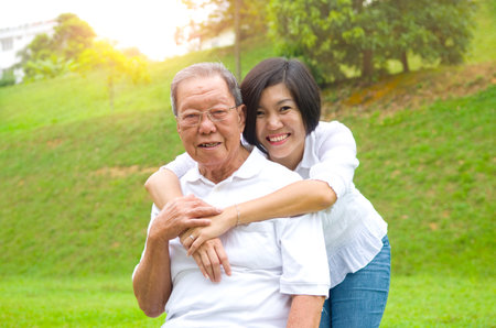 Senior man and daughter. Happy father talking with her daughter.の写真素材