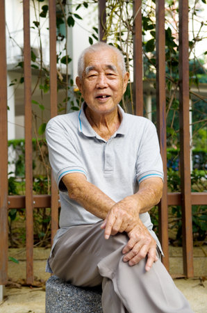 Portrait of a smiling asian senior manの写真素材
