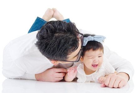 Asian father with his cute daughterの写真素材