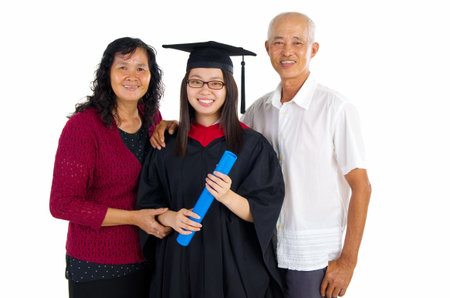 Asian university student and family celebrating graduationの写真素材