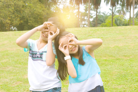 Asian children having fun at outdoorの写真素材