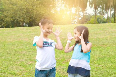 Asian children having fun at outdoorの写真素材