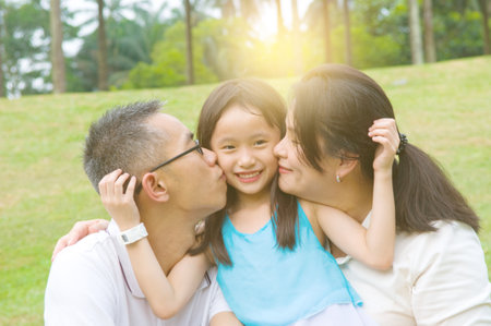 Outdoor portrait of asian familyの写真素材