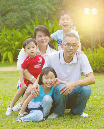 Outdoor portrait of happy asian familyの写真素材