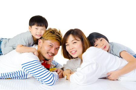 Indoor portrait of a beautiful asian familyの写真素材