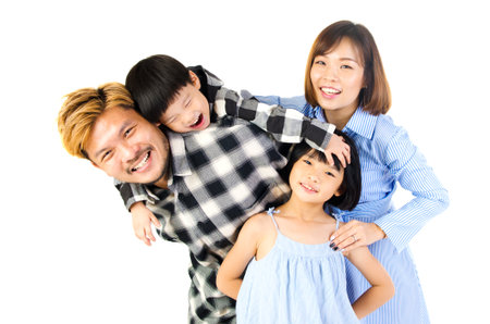Indoor portrait of a happy asian familyの写真素材