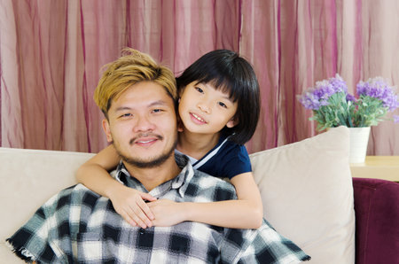 happy asian family in the living roomの写真素材