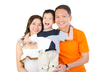 Indoor portrait of a happy asian familyの写真素材