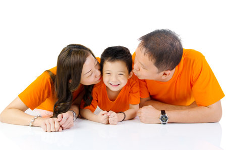 Indoor portrait of asian family at homeの写真素材