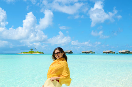 Portrait of happy young woman at  Maldives island. Travel and Vacation.の写真素材