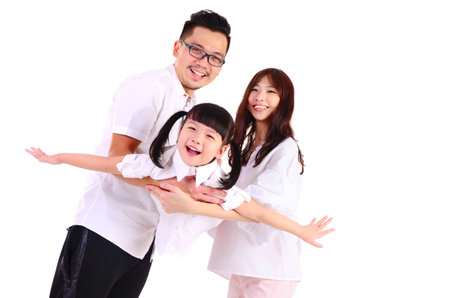 Indoor portrait of a happy asian familyの写真素材