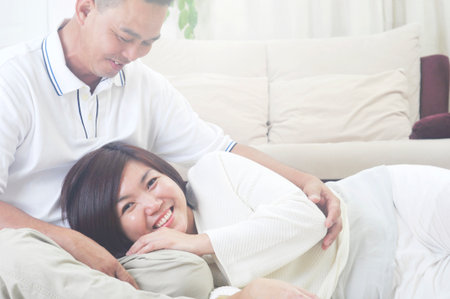 Happy Asian Middle age couple  in love having a good time at homeの写真素材
