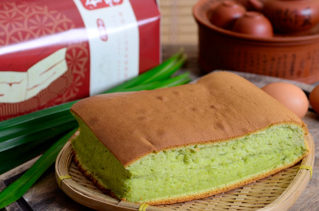 Taiwanese  sponge cake with Pandanus amaryllifolius on bamboo weave basketの写真素材