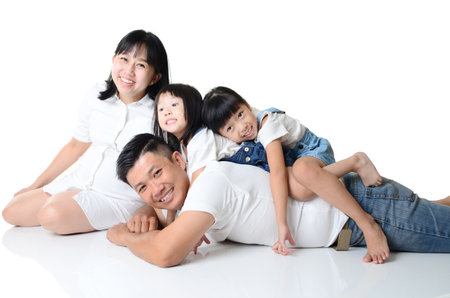 Portrait of a happy asian family in the studioの写真素材