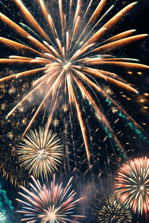 Colorful fireworks of various colors over night sky. Abstract background.の素材