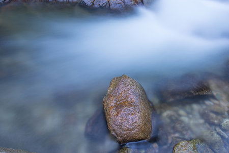 Rocks and pebbles At the stream of natural waterfallの写真素材