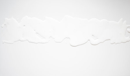White liquid texture surface on white backgroundの写真素材