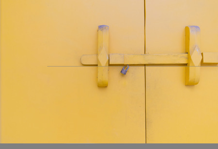 Large yellow door There is also an ancient door lock.