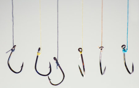 Many fishing hooks hang together.の写真素材