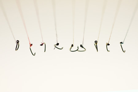 Many fishing hooks hang together.の写真素材