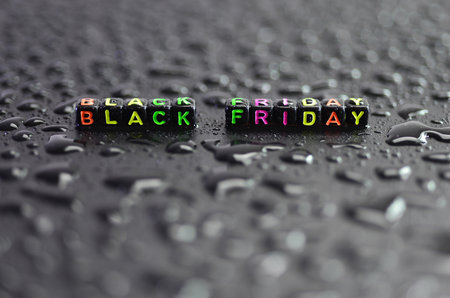 Black Friday, on the ground, liquid drops, abstract shapes on a black background.