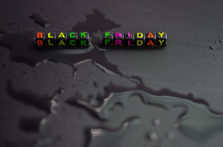 Black Friday, on liquid water, abstract shapes on a black background.の写真素材