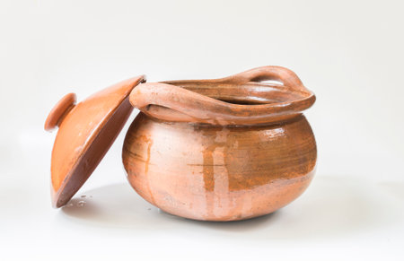A pot made of clay, beautiful shape, placed on a white background.の写真素材