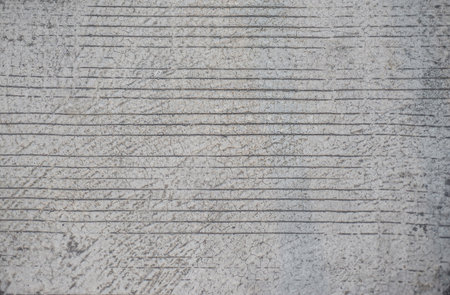 Texture surface cement material The concrete is patterned after work and begins to crack.