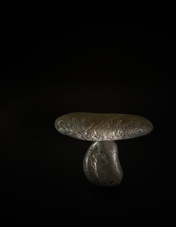 The concept of balance, stones, shapes and textures together with the natural balance on a black background.の写真素材