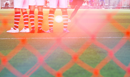 The footballer is about to kick the ball from the free kick, with the opponent standing guard.の写真素材