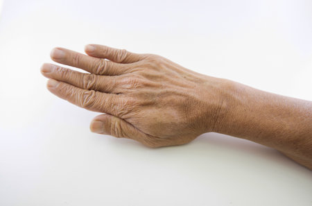 Hand and finger man is rough skin and wrinkles. Gesture on a white background with space.の写真素材